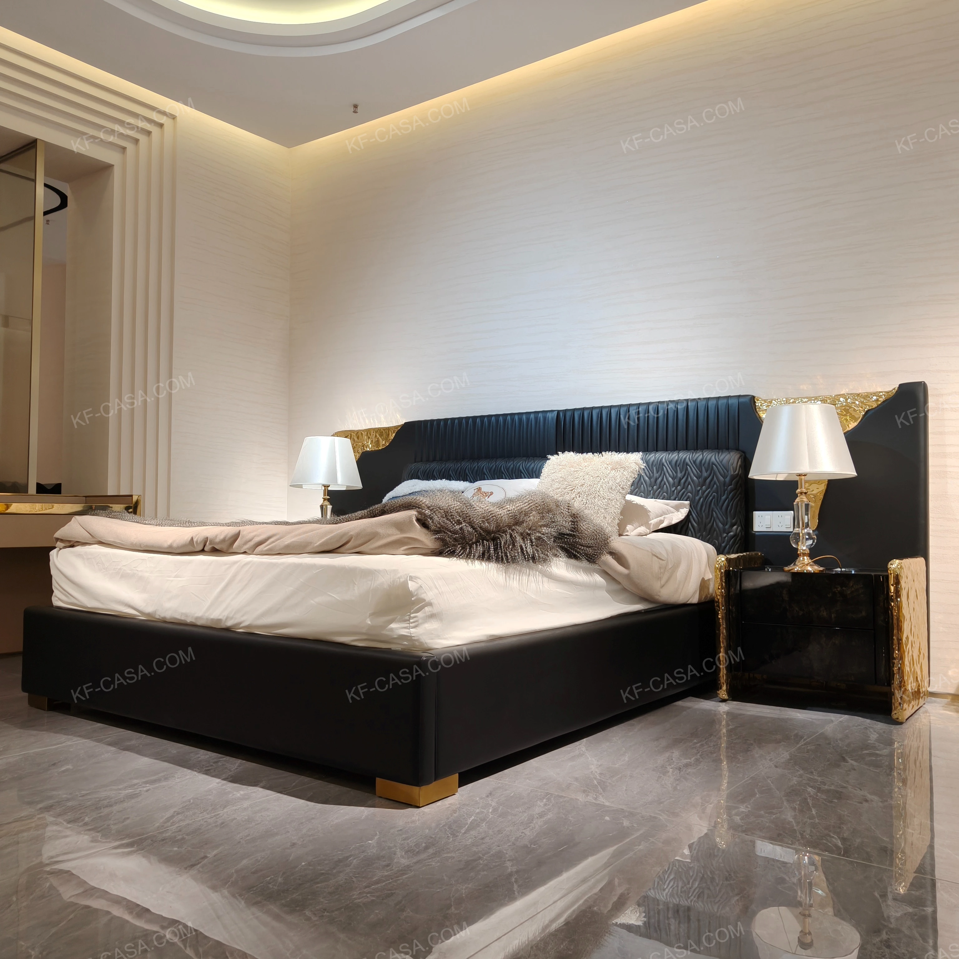 Black Leather Upholstered Bed with Textured Gold Accents, Patterned Quilted Detailing & Brass Hardware Feet